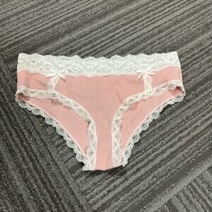 Girly baby pink underwear with lace trim and bows.